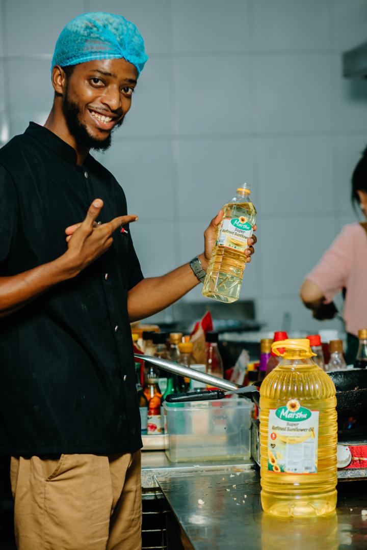 Chef cooking with Marshu Oil